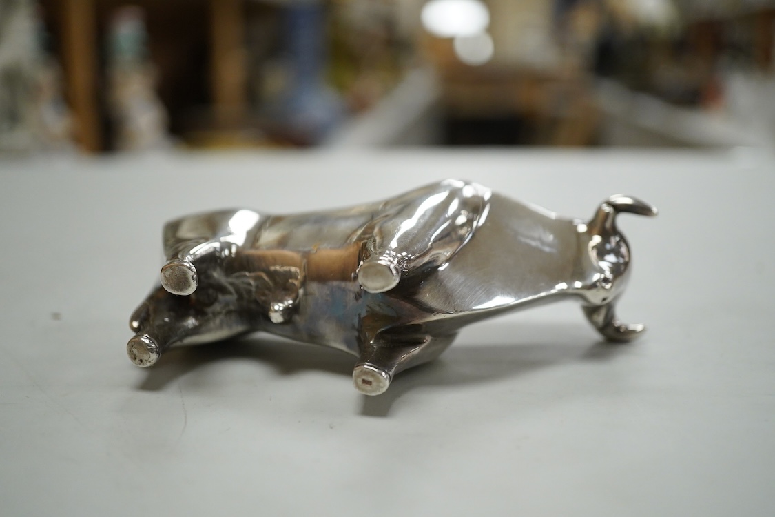 A stylised white metal (stamped 925) miniature model of a bull, length 11.5cm, height 7cm, 30oz.